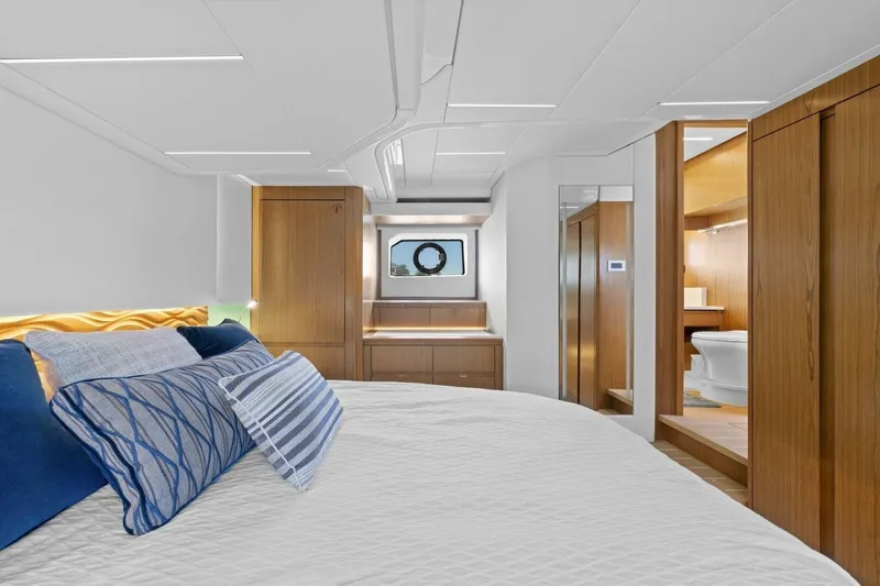 Tranquil Moments II Yacht Photos Pics Luxurious 2023 Tiara Yachts EX 60 cabin interior with elegant wood finishes and modern design.
