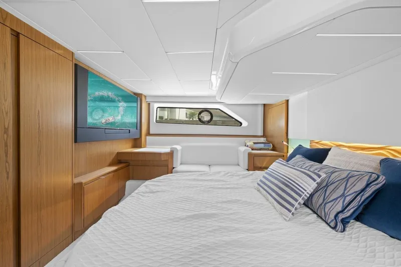 Tranquil Moments II Yacht Photos Pics Luxurious 2023 Tiara Yachts EX 60 cabin with modern design and comfortable bedding.