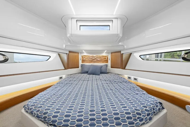 Tranquil Moments II Yacht Photos Pics Luxurious 2023 Tiara Yachts EX 60 cabin with modern design and comfortable bedding.