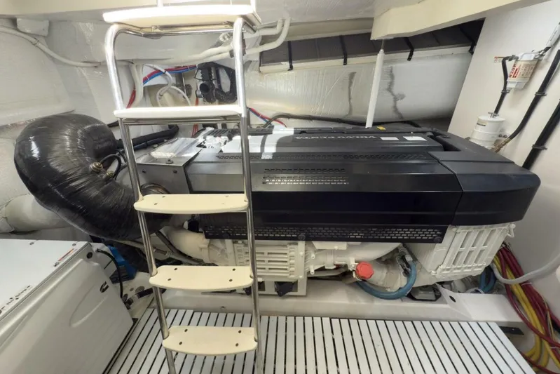 Tranquil Moments II Yacht Photos Pics Engine room of 2023 Tiara Yachts EX 60 with ladder and machinery.