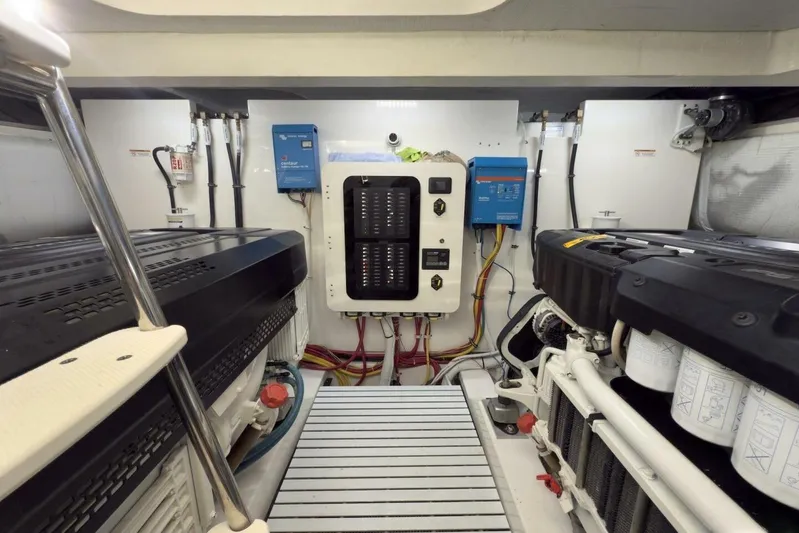 Tranquil Moments II Yacht Photos Pics Engine room of 2023 Tiara Yachts EX 60, featuring electrical panels and equipment.