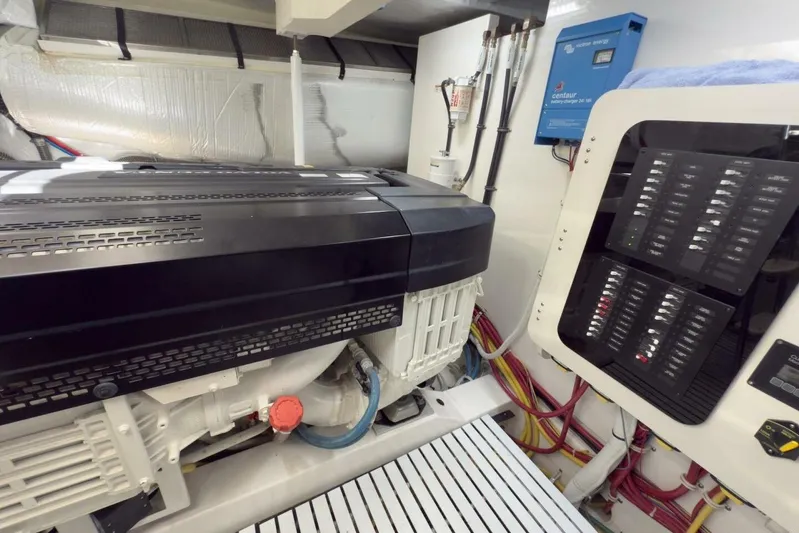 Tranquil Moments II Yacht Photos Pics Engine room of 2023 Tiara Yachts EX 60, featuring advanced machinery and control panels.