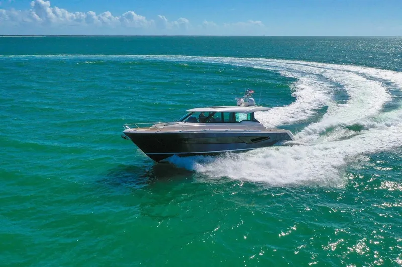 Tranquil Moments II Yacht Photos Pics 2023 Tiara Yachts EX 60 cruising on vibrant turquoise ocean waters.