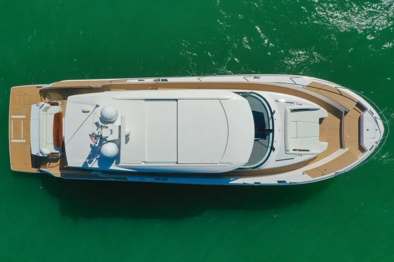 Tranquil Moments II Yacht Photos Pics Aerial view of 2023 Tiara Yachts EX 60 luxury yacht on green water.