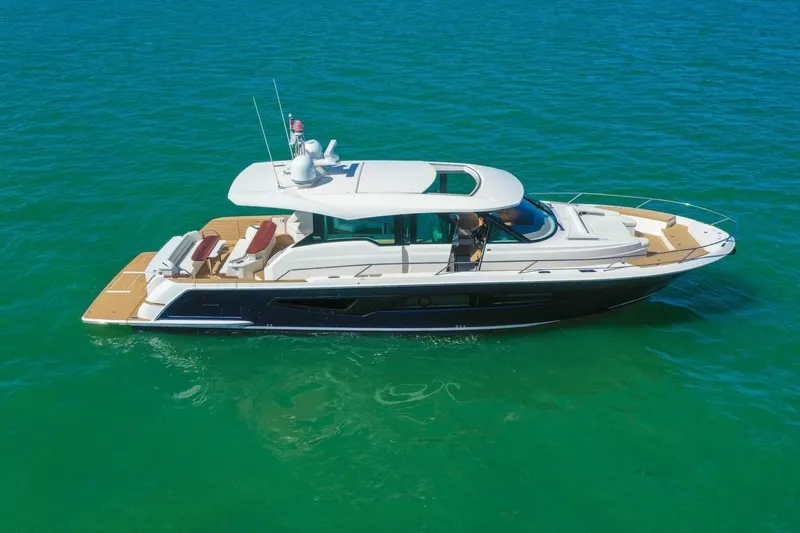 Tranquil Moments II Yacht Photos Pics 2023 Tiara Yachts EX 60 luxury yacht cruising on clear blue water.