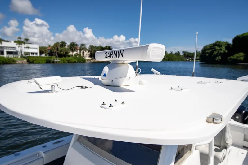  Yacht Photos Pics 2019 Invincible 37 Catamaran with Garmin radar on calm water, clear sky background.