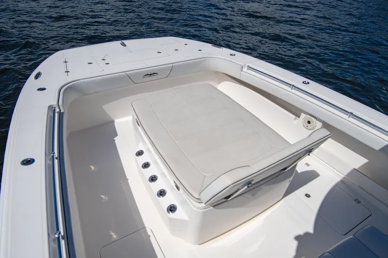  Yacht Photos Pics 2019 Invincible 37 Catamaran's spacious deck with cushioned seating, overlooking the water.