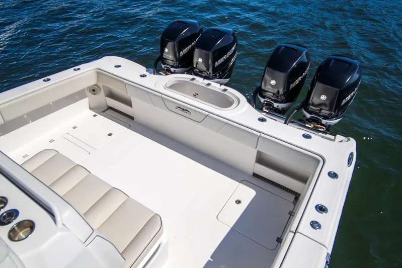  Yacht Photos Pics 2019 Invincible 37 Catamaran with quad Mercury engines on open water.