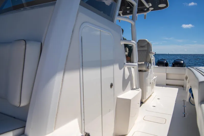  Yacht Photos Pics 2019 Invincible 37 Catamaran interior with seating, ocean view, and clear blue sky.