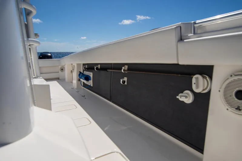  Yacht Photos Pics 2019 Invincible 37 Catamaran deck with storage compartments and ocean view.
