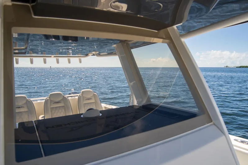  Yacht Photos Pics 2019 Invincible 37 Catamaran on open water, showcasing luxurious seating and ocean view.