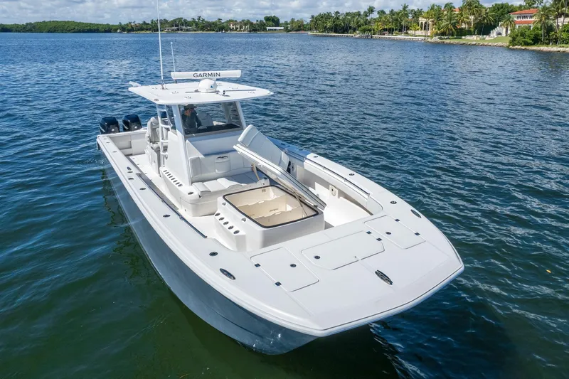  Yacht Photos Pics 2019 Invincible 37 Catamaran on calm water, featuring spacious deck and modern design.