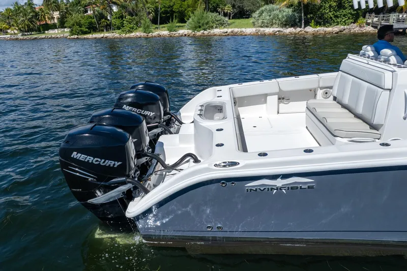  Yacht Photos Pics 2019 Invincible 37 Catamaran with Mercury engines on a calm waterway.