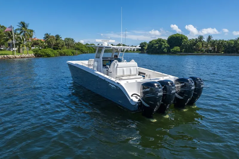  Yacht Photos Pics 2019 Invincible 37 Catamaran with four Mercury engines on a scenic waterway.