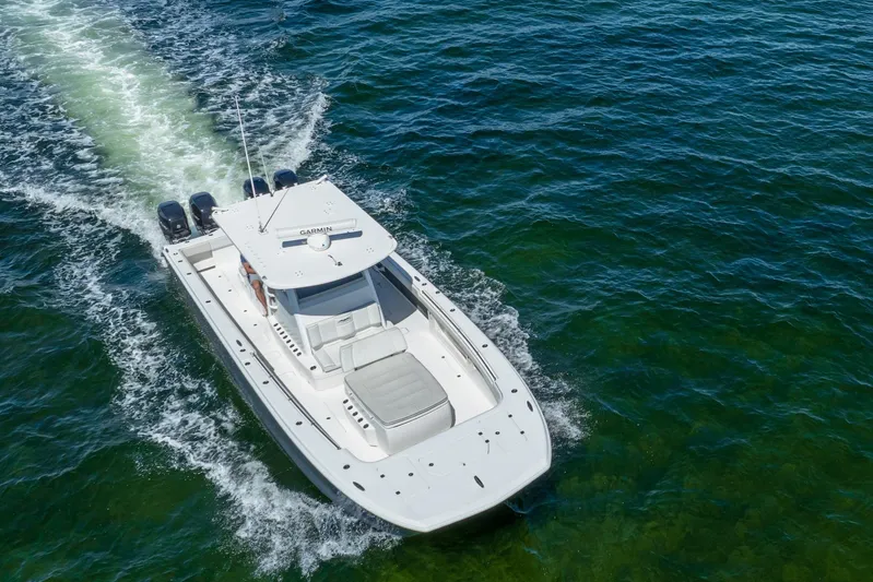  Yacht Photos Pics 2019 Invincible 37 Catamaran cruising on open water, aerial view.