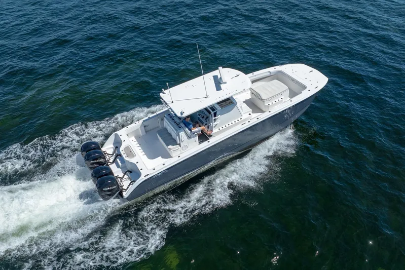  Yacht Photos Pics 2019 Invincible 37 Catamaran cruising on open water, aerial view.