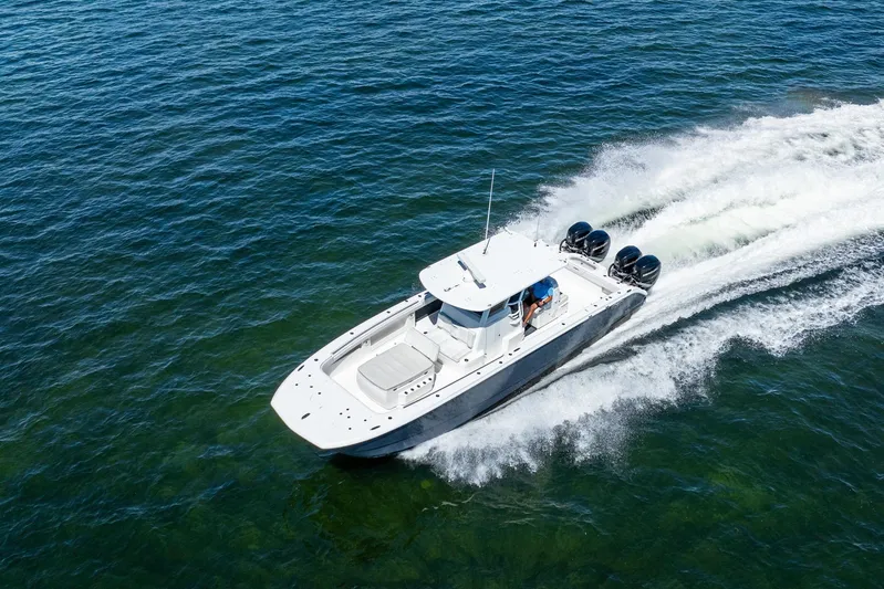  Yacht Photos Pics 2019 Invincible 37 Catamaran cruising on open water, showcasing speed and performance.
