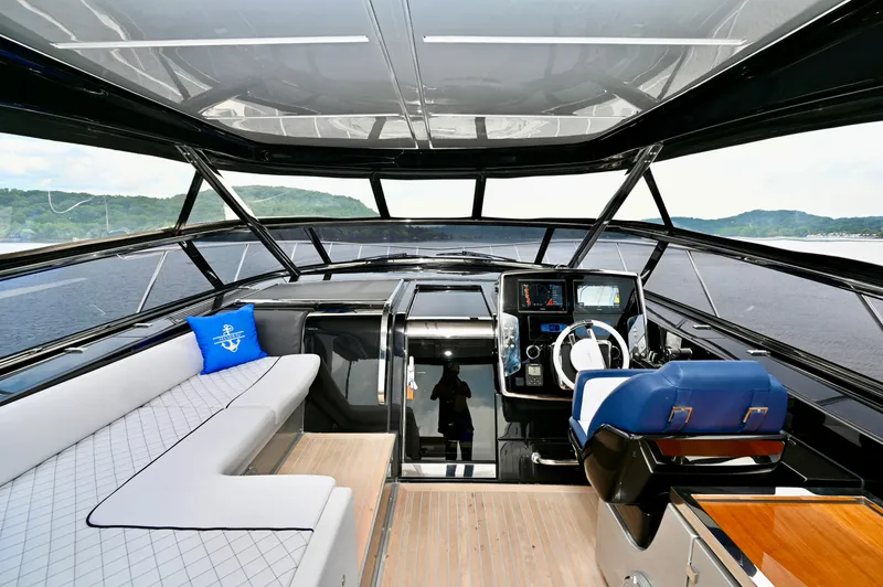 Maximus Yacht Photos Pics Interior of 2023 Riva 56 Rivale yacht with modern helm and seating area.