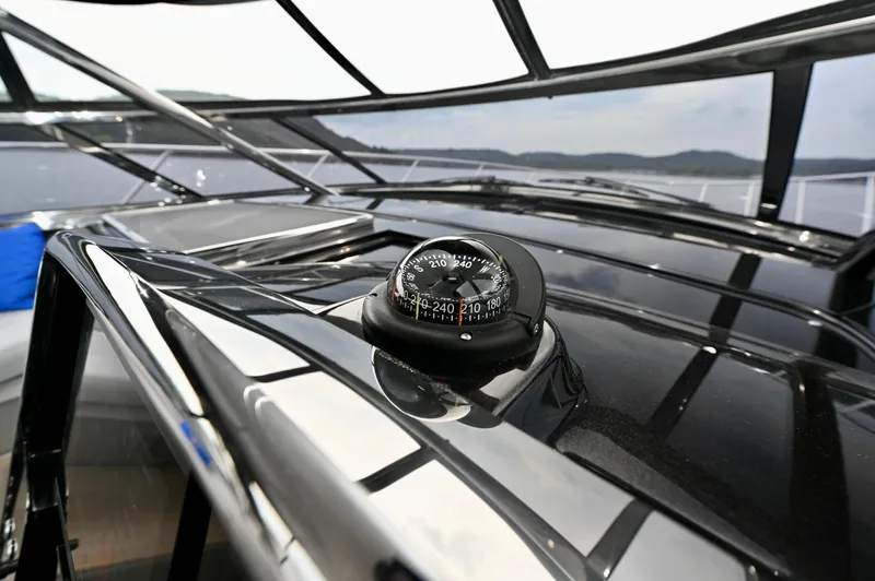Maximus Yacht Photos Pics Compass on the sleek deck of a 2023 Riva 56 Rivale yacht.