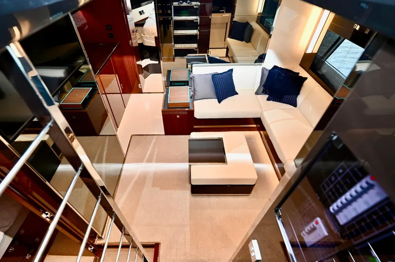 Maximus Yacht Photos Pics Luxurious interior of 2023 Riva 56 Rivale yacht with modern furnishings and elegant design.