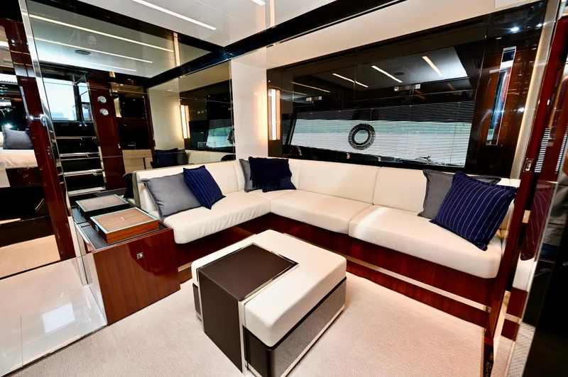 Maximus Yacht Photos Pics Luxurious interior of 2023 Riva 56 RIVALE yacht with modern seating and elegant decor.