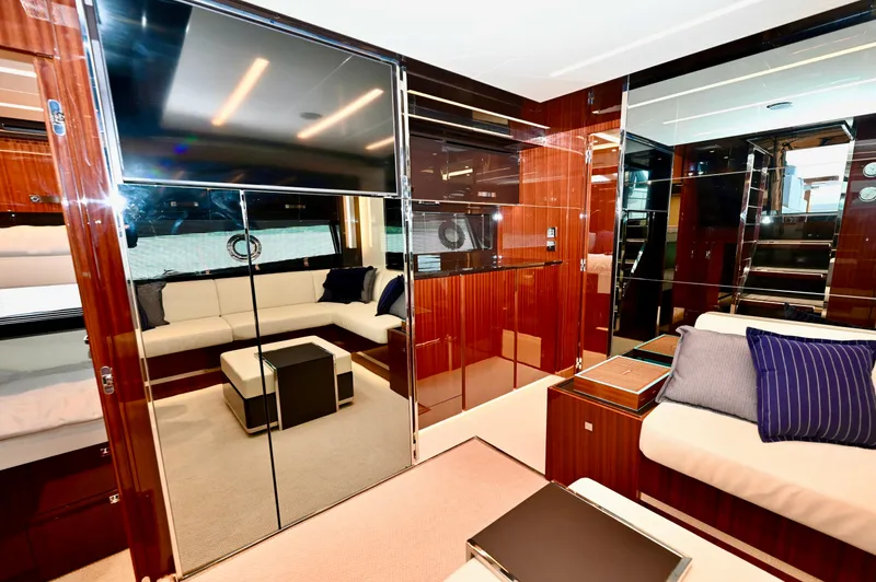 Maximus Yacht Photos Pics Luxurious interior of 2023 Riva 56 Rivale yacht with modern furnishings and sleek design.