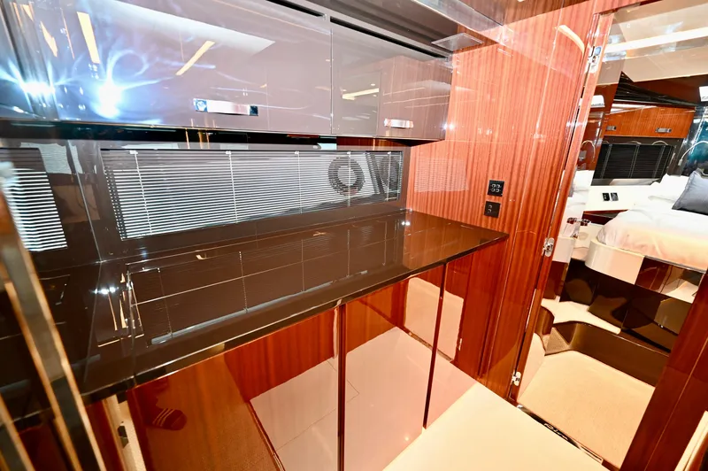 Maximus Yacht Photos Pics Luxurious interior of 2023 Riva 56 Rivale yacht with sleek cabinetry and modern design.