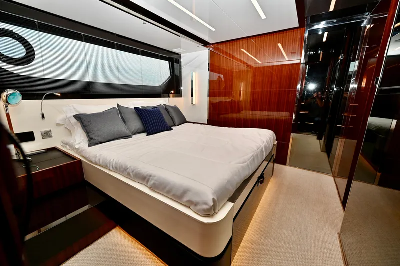 Maximus Yacht Photos Pics Luxurious bedroom interior of 2023 Riva 56 Rivale yacht with modern design.