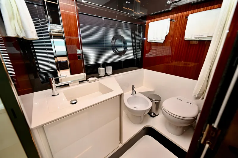 Maximus Yacht Photos Pics Luxurious bathroom on the 2023 Riva 56 Rivale yacht with modern fixtures.