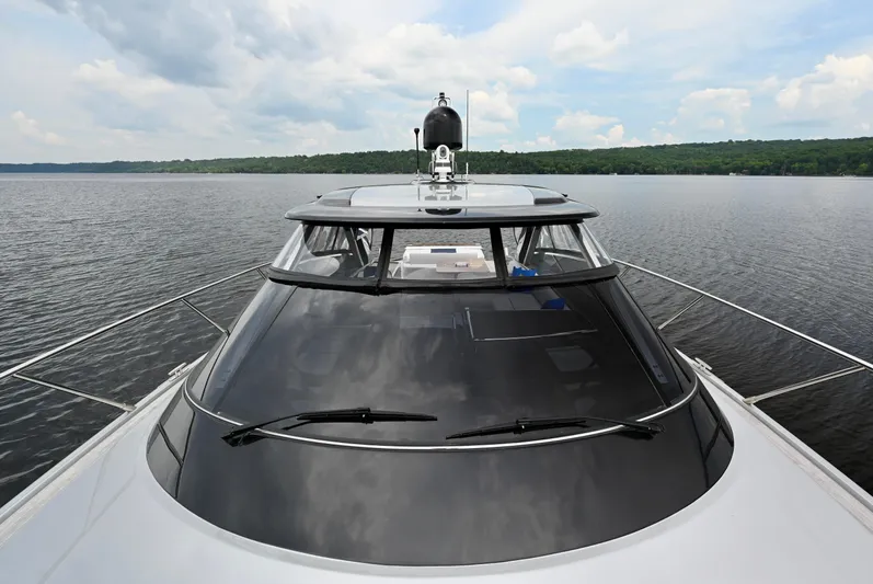 Maximus Yacht Photos Pics 2023 Riva 56 Rivale luxury yacht on a serene lake.