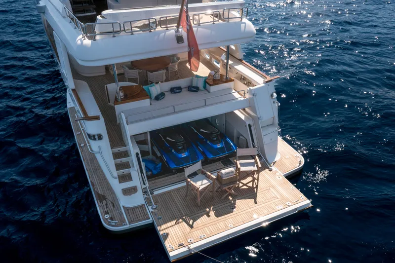 Centurion Yacht Photos Pics Luxurious 2013 Custom Line Navetta 33 Crescendo yacht with open deck and jet skis.