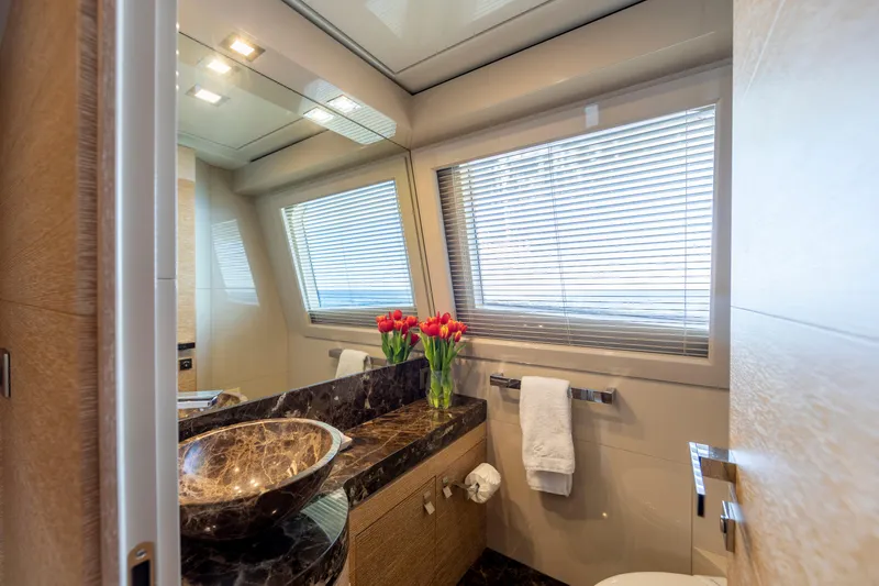 Centurion Yacht Photos Pics Luxurious bathroom on 2013 Custom Line Navetta 33 Crescendo yacht with marble sink and tulip decor.