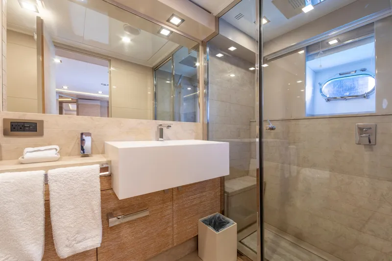 Centurion Yacht Photos Pics Luxurious bathroom on 2013 Custom Line Navetta 33 Crescendo yacht, featuring modern fixtures and elegant design.