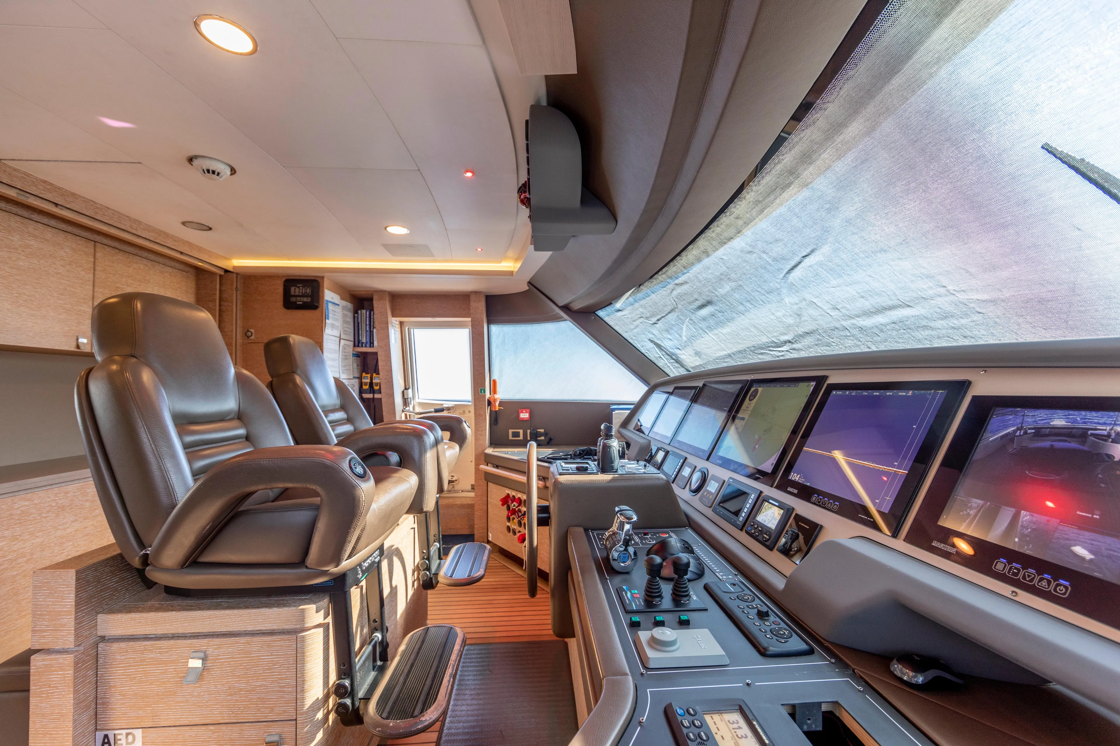 Centurion Yacht Photos Pics Luxurious 2013 Custom Line Navetta 33 Crescendo yacht cockpit with advanced navigation systems.