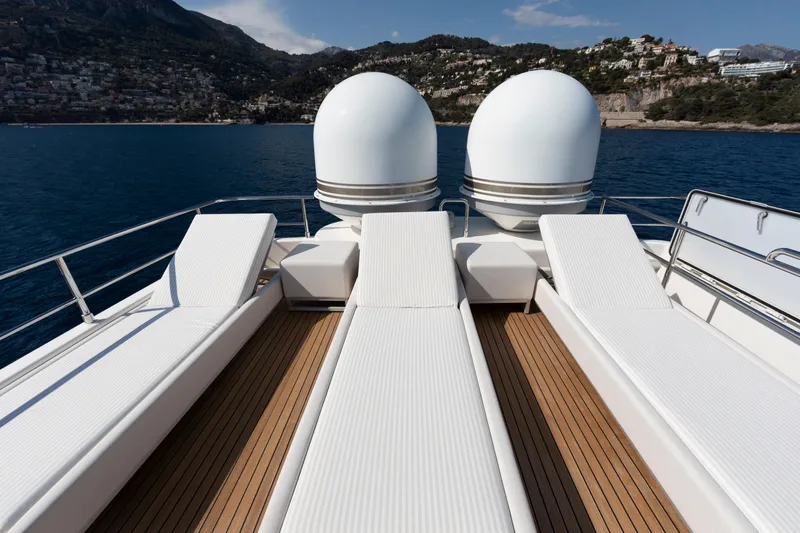 Centurion Yacht Photos Pics Luxurious sun deck on 2013 Custom Line Navetta 33 Crescendo yacht with scenic ocean view.