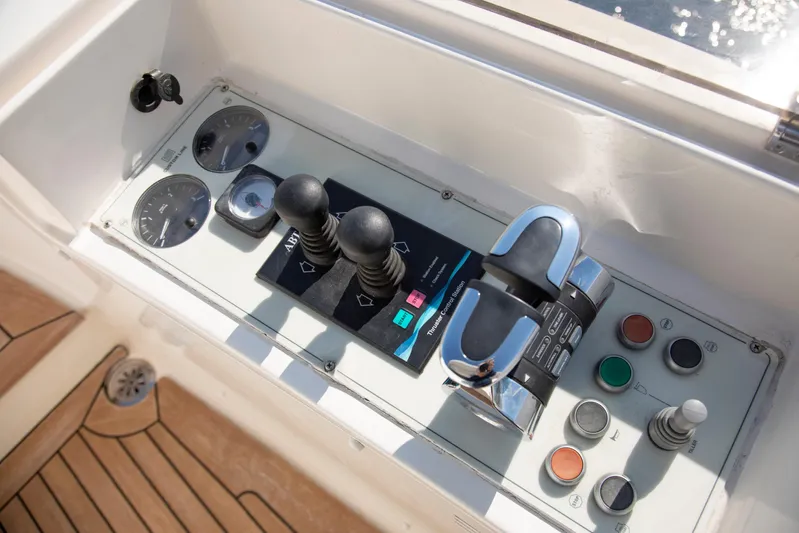 Centurion Yacht Photos Pics Control panel of 2013 Custom Line Navetta 33 Crescendo yacht with gauges and levers.