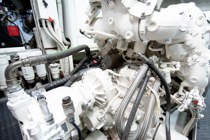 Centurion Yacht Photos Pics Engine room of 2013 Custom Line Navetta 33 Crescendo yacht, showcasing complex machinery and piping.