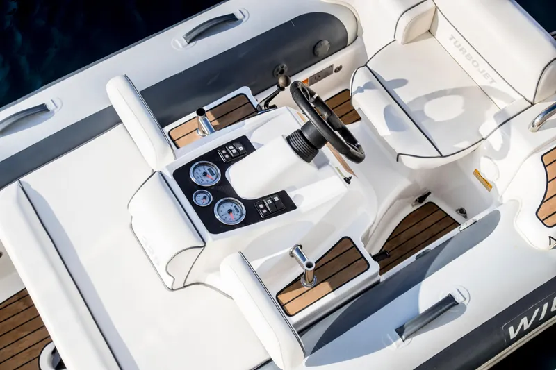 Centurion Yacht Photos Pics Cockpit of 2013 Custom Line Navetta 33 Crescendo yacht with steering wheel and gauges.