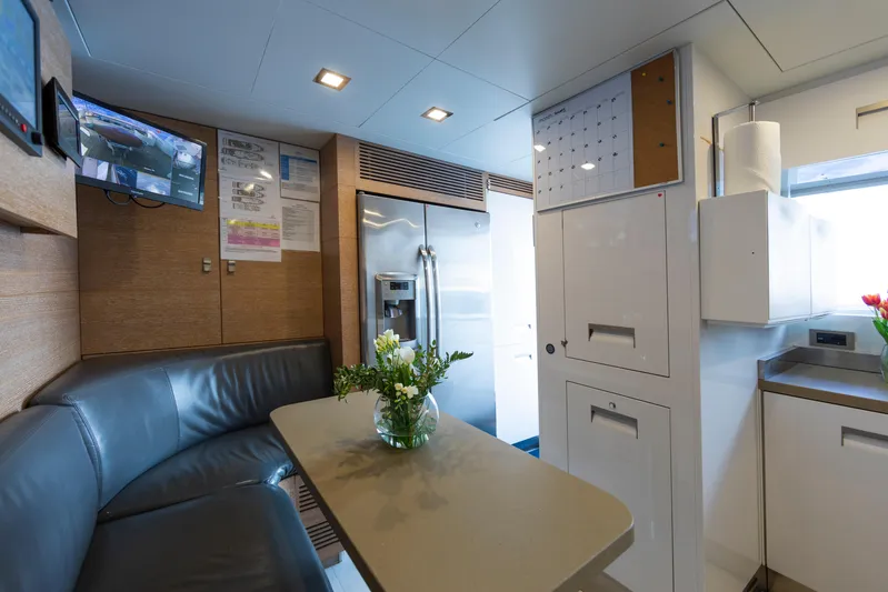 Centurion Yacht Photos Pics Luxurious 2013 Custom Line Navetta 33 Crescendo yacht interior with modern kitchen and seating area.