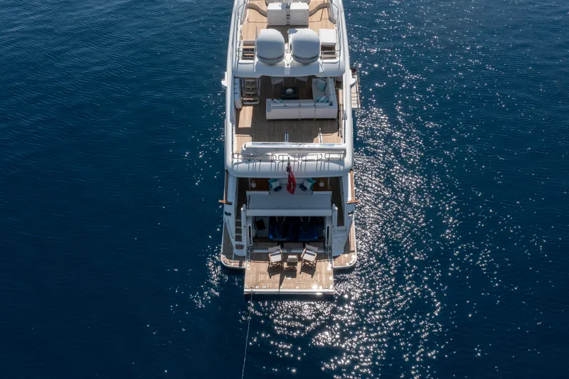 Centurion Yacht Photos Pics Aerial view of 2013 Custom Line Navetta 33 Crescendo yacht on sparkling blue water.