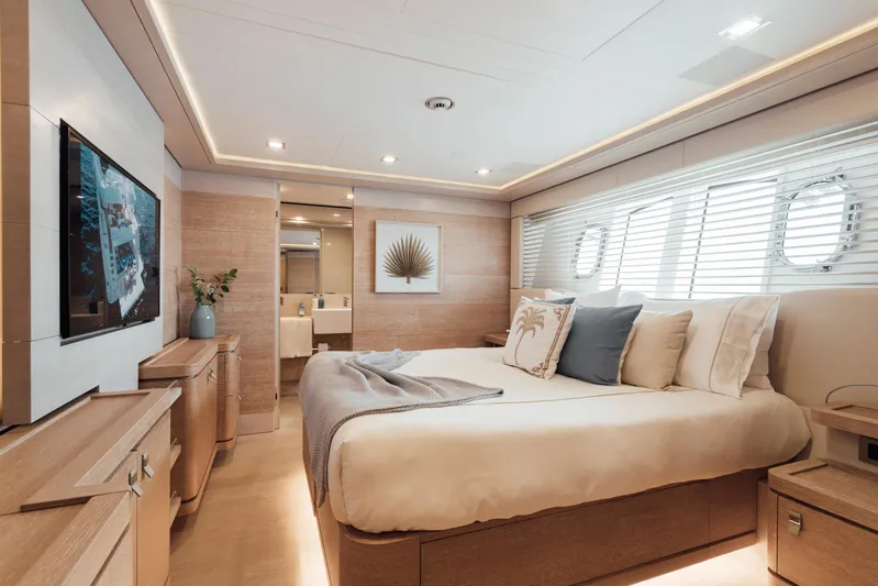 Centurion Yacht Photos Pics Luxurious bedroom interior on 2013 Custom Line Navetta 33 Crescendo yacht, featuring elegant decor and modern amenities.