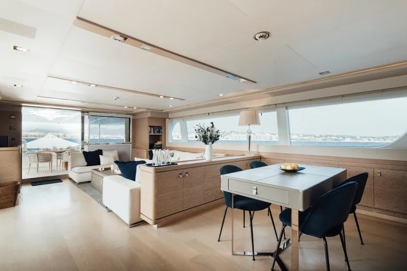 Centurion Yacht Photos Pics Luxurious interior of 2013 Custom Line Navetta 33 Crescendo yacht with elegant dining and seating area.