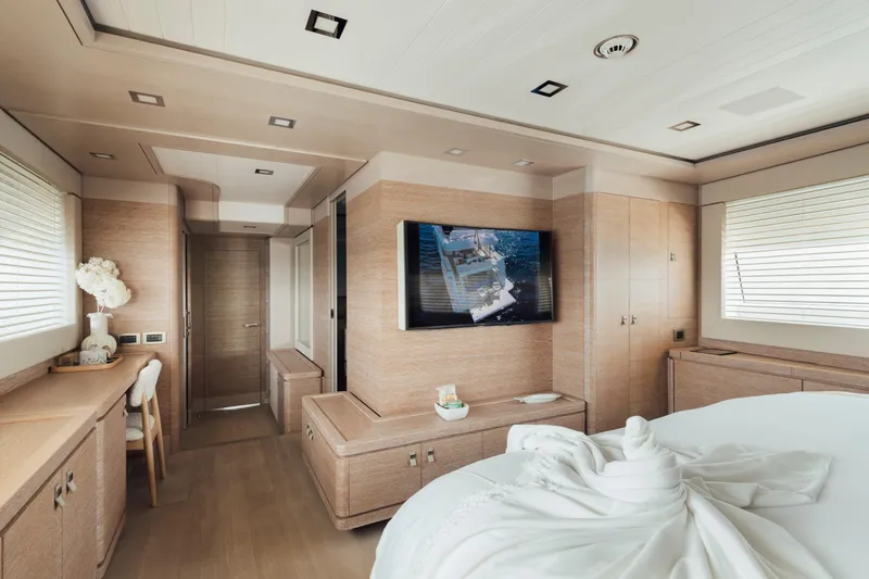 Centurion Yacht Photos Pics Luxurious interior of 2013 Custom Line Navetta 33 Crescendo yacht with modern decor and TV.