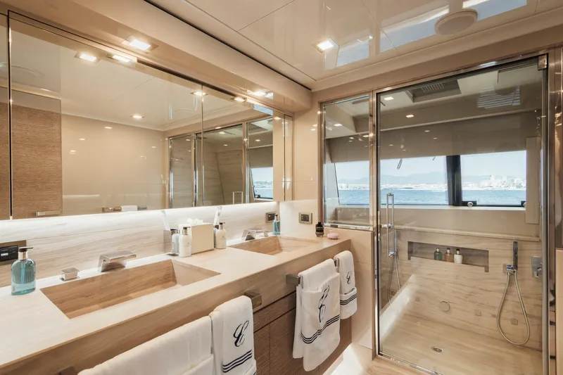 Centurion Yacht Photos Pics Luxurious bathroom on 2013 Custom Line Navetta 33 Crescendo yacht with dual sinks and ocean view.