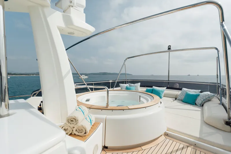 Centurion Yacht Photos Pics Luxurious 2013 Custom Line Navetta 33 Crescendo yacht deck with jacuzzi and ocean view.