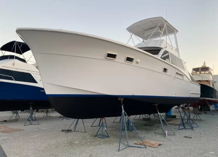 Mary L Yacht Photos Pics 1971 Hatteras 45 Convertible yacht on stands in a boatyard.