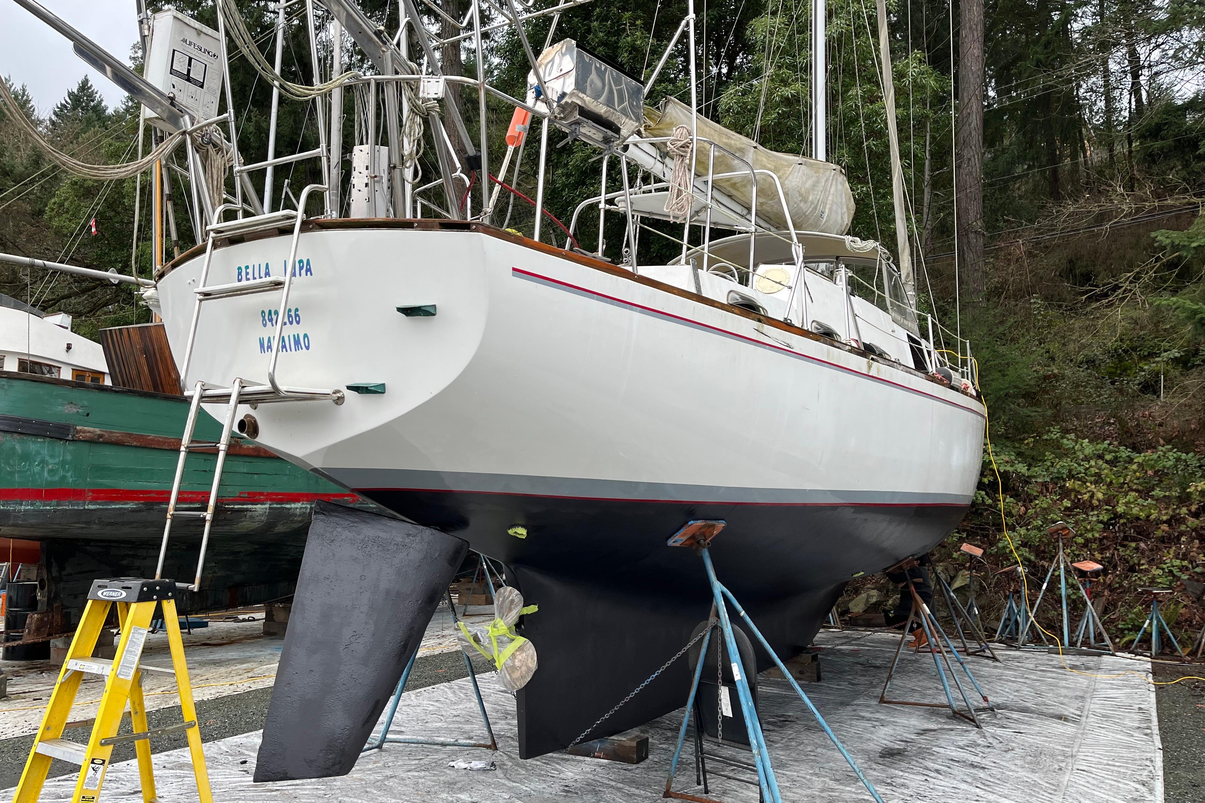 Sailboat "Bella Lupa" on land, CAL 2-46 model, 1972, undergoing maintenance.
