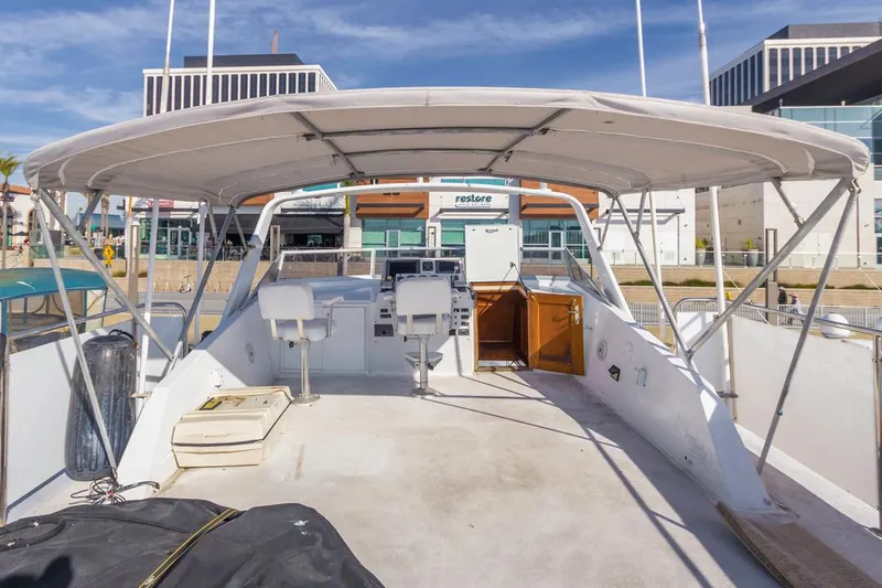  Yacht Photos Pics 1981 Hatteras Extended Deckhouse yacht with covered helm and seating area.