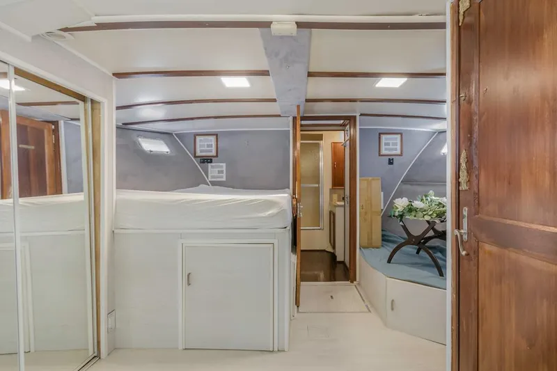  Yacht Photos Pics Interior of 1981 Hatteras Extended Deckhouse yacht, featuring cozy cabin and wooden accents.