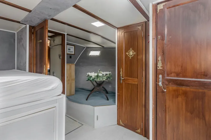  Yacht Photos Pics Interior of 1981 Hatteras Extended Deckhouse with wood accents and elegant decor.
